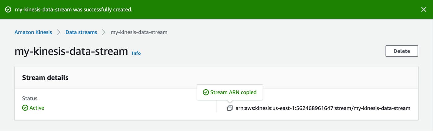 A Kinesis web page shows a banner stating that the stream was successfully created, and acknowledges that that stream's ARN has been copied to the user's clipboard. A Kinesis web page shows a banner stating that the stream was successfully created, and acknowledges that that stream's ARN has been copied to the user's clipboard.