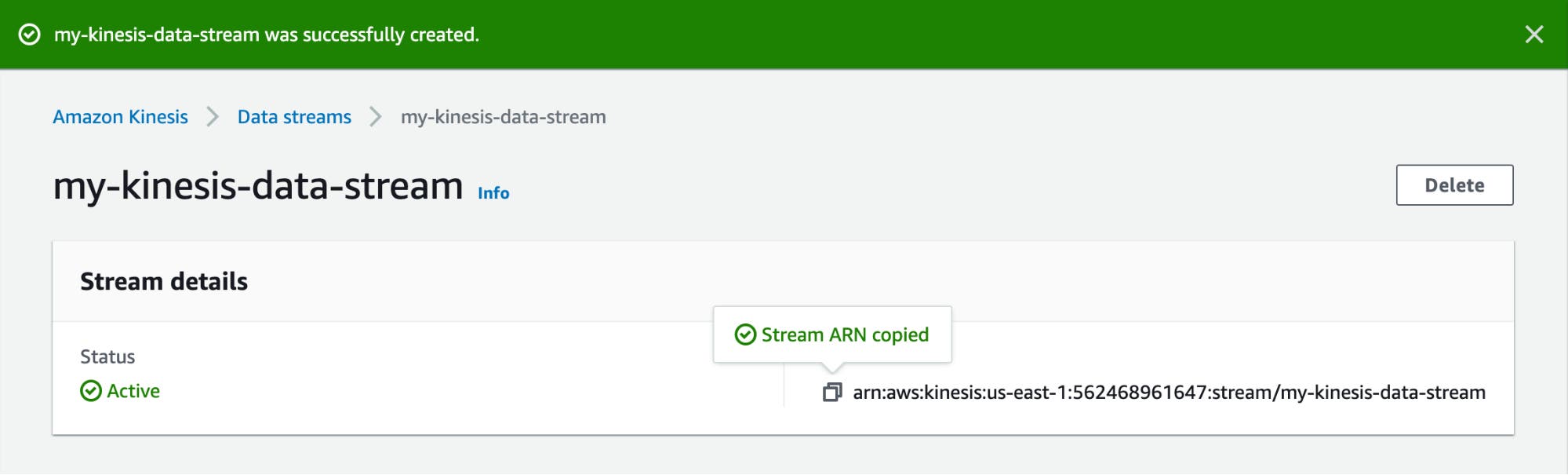 A Kinesis web page shows a banner stating that the stream was successfully created, and acknowledges that that stream's ARN has been copied to the user's clipboard. A Kinesis web page shows a banner stating that the stream was successfully created, and acknowledges that that stream's ARN has been copied to the user's clipboard.