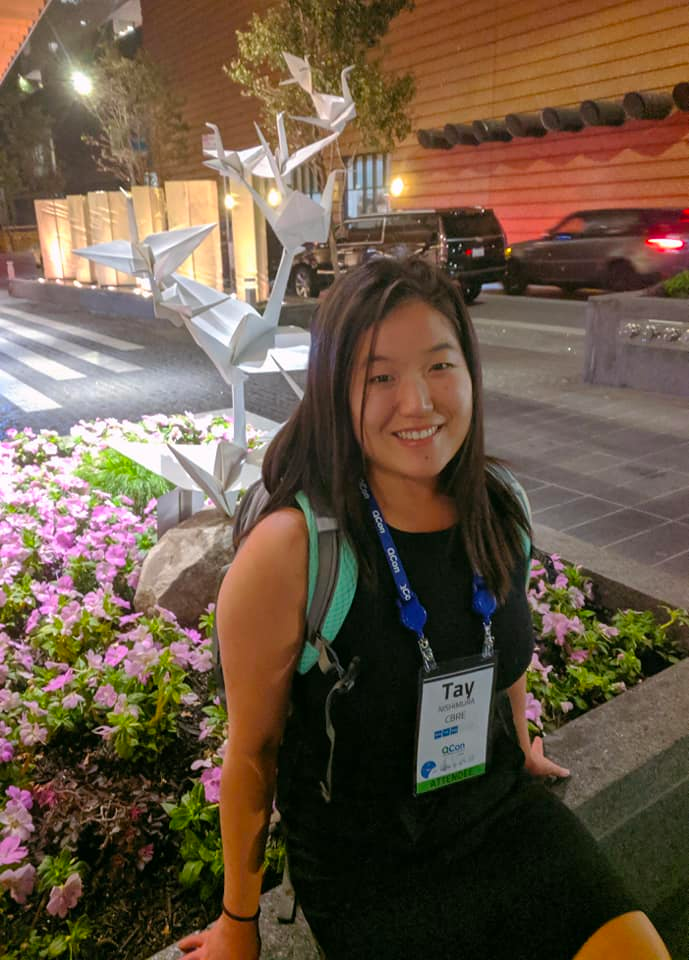 Photograph of Tay Nishimura wearing a backpack.